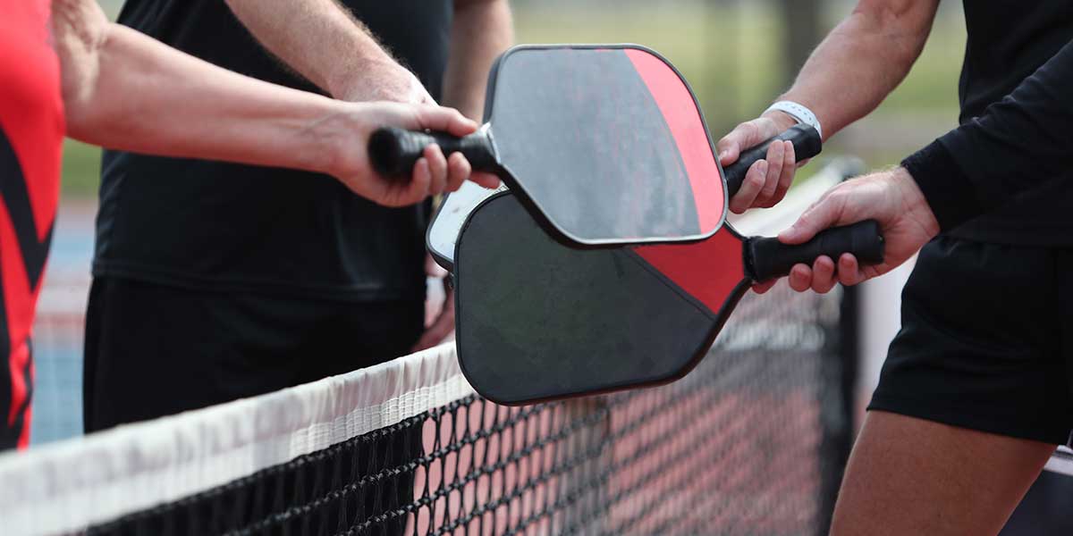 pickleball, pickleball paddles and players